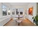 Charming breakfast nook with a table and chairs, bathed in sunlight from large windows at 1433 E 7Th Ave, Denver, CO 80218