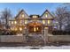 Stunning brick home with a grand facade, inviting porch, and charming landscaping at 1433 E 7Th Ave, Denver, CO 80218