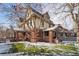 Charming two-story home with snow covered lawn at 1433 E 7Th Ave, Denver, CO 80218