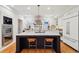 Modern kitchen with stainless steel appliances, marble countertops, and a large island at 1433 E 7Th Ave, Denver, CO 80218