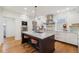 Modern kitchen with stainless steel appliances and a large center island at 1433 E 7Th Ave, Denver, CO 80218