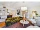 Open living room showcasing a stylish sofa and a view into the kitchen at 1433 E 7Th Ave, Denver, CO 80218