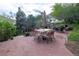 Outdoor patio with seating area surrounded by a lush yard space, grill, and firepit at 2795 Se Grapevine Rd, Idledale, CO 80453