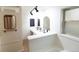 Elegant bathroom with dual sinks, mirrors, and stylish fixtures, offering a modern aesthetic at 2795 Se Grapevine Rd, Idledale, CO 80453
