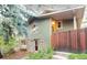 Charming home with stone accents and a rustic wooden fence for added privacy at 2795 Se Grapevine Rd, Idledale, CO 80453