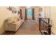 Sunlit living room with comfortable couch, large window, and desk area at 2795 Se Grapevine Rd, Idledale, CO 80453