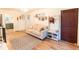 Inviting living room features hardwood floors, neutral paint, and a charming entryway at 2795 Se Grapevine Rd, Idledale, CO 80453