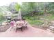 Backyard patio with outdoor seating area and gorgeous lush outdoor space with string lights at 2795 Se Grapevine Rd, Idledale, CO 80453