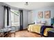 Bright bedroom with hardwood floors and charming decor featuring a colorful accent pillow at 8140 S Storm King Peak, Littleton, CO 80127