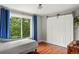 Serene bedroom featuring a closet with barn door and large window view at 8140 S Storm King Peak, Littleton, CO 80127