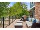 Outdoor deck with comfortable seating area featuring sofa and ottomans ideal for relaxing at 8140 S Storm King Peak, Littleton, CO 80127