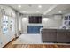 Spacious living room with hardwood floors, television, and comfortable seating area at 8140 S Storm King Peak, Littleton, CO 80127