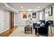 Stylish living room with a rustic storage chest and an accent wall at 8140 S Storm King Peak, Littleton, CO 80127