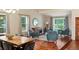 Inviting living room with vaulted ceilings, hardwood floors, comfortable seating, and natural light at 8140 S Storm King Peak, Littleton, CO 80127