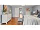 A spacious main bedroom features hardwood floors, dresser storage, and plenty of natural light at 8140 S Storm King Peak, Littleton, CO 80127