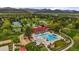 Resort-style pool and recreation area surrounded by lush landscaping, tennis courts, and playground at 8140 S Storm King Peak, Littleton, CO 80127
