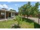 Well-maintained backyard with a green lawn, mature trees, and a tidy patio area perfect for outdoor relaxation and entertaining at 4705 Upham St, Wheat Ridge, CO 80033