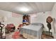 Basement bedroom with a full-sized bed, dresser, carpet, and finished ceiling at 4705 Upham St, Wheat Ridge, CO 80033