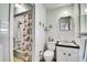 Charming bathroom with stylish fixtures and shower/tub combo at 4705 Upham St, Wheat Ridge, CO 80033