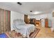 Bedroom with a queen bed, carpet, and a wooden desk at 4705 Upham St, Wheat Ridge, CO 80033