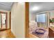Cozy bedroom featuring hardwood floors and floral bed at 4705 Upham St, Wheat Ridge, CO 80033