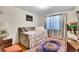 Bedroom with a daybed, hardwood floors, and natural light at 4705 Upham St, Wheat Ridge, CO 80033