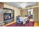 Charming dining area adjacent to a display cabinet and bright windows at 4705 Upham St, Wheat Ridge, CO 80033