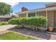 Brick home with trimmed bushes and a sidewalk leading to the front door at 4705 Upham St, Wheat Ridge, CO 80033
