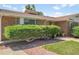 Well-kept brick home showcasing tidy bushes and a manicured front yard at 4705 Upham St, Wheat Ridge, CO 80033