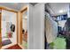 Hallway with multiple rooms and storage, with carpet and tile flooring at 4705 Upham St, Wheat Ridge, CO 80033