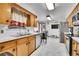 Spacious kitchen with stainless steel fridge and adjacent dining area at 4705 Upham St, Wheat Ridge, CO 80033