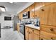 Kitchen featuring wood cabinets, modern appliances, and stainless steel refrigerator at 4705 Upham St, Wheat Ridge, CO 80033