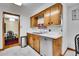 Functional kitchen with stainless steel appliances and wood cabinetry at 4705 Upham St, Wheat Ridge, CO 80033