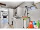 Bright laundry room featuring modern washer and dryer with white cabinets for convenient storage at 4705 Upham St, Wheat Ridge, CO 80033