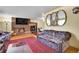 Cozy living room with a brick fireplace and classic hardwood floors at 4705 Upham St, Wheat Ridge, CO 80033