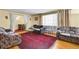 Spacious living room with hardwood floors and plenty of seating options at 4705 Upham St, Wheat Ridge, CO 80033