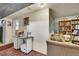 Living room area with a sofa, desk, bookcase, and a world map at 4705 Upham St, Wheat Ridge, CO 80033