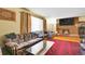 Comfortable living room featuring a brick fireplace and ample natural light at 4705 Upham St, Wheat Ridge, CO 80033