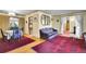 Open living area with hardwood floors connecting to the dining space at 4705 Upham St, Wheat Ridge, CO 80033