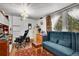 Cozy home office with an ornate light fixture, couch and curtains, perfect for working remotely at 4705 Upham St, Wheat Ridge, CO 80033