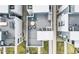 Aerial view of a townhouse community featuring a rooftop deck with outdoor seating and modern architectural design at 1733 Irving St # 101, Denver, CO 80204