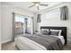 A beautifully staged bedroom with modern decor, a comfortable bed, and a private balcony at 1733 Irving St # 101, Denver, CO 80204
