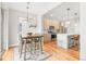 Eat-in kitchen with modern light fixture and stainless steel appliances at 1733 Irving St # 101, Denver, CO 80204