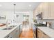 Open concept kitchen with stainless appliances, white countertops, and view to the dining area at 1733 Irving St # 101, Denver, CO 80204