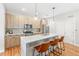 Modern kitchen features light wood cabinets, stainless steel appliances, and a quartz island at 1733 Irving St # 101, Denver, CO 80204