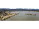 Scenic lakefront park with walking paths, trees, and a small island at 1733 Irving St # 101, Denver, CO 80204