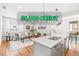 Bright and airy living room showcasing modern gray tones, beautiful hardwood floors, and ample natural light at 1733 Irving St # 101, Denver, CO 80204