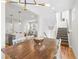 Open concept living area with dining room, kitchen, and stairway at 1733 Irving St # 101, Denver, CO 80204