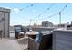 Stylish rooftop deck with comfortable seating around a central fire pit, perfect for entertaining guests at 1733 Irving St # 101, Denver, CO 80204
