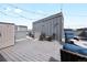 Expansive rooftop deck featuring a fire pit, outdoor seating, and city views in a stylish setting at 1733 Irving St # 101, Denver, CO 80204